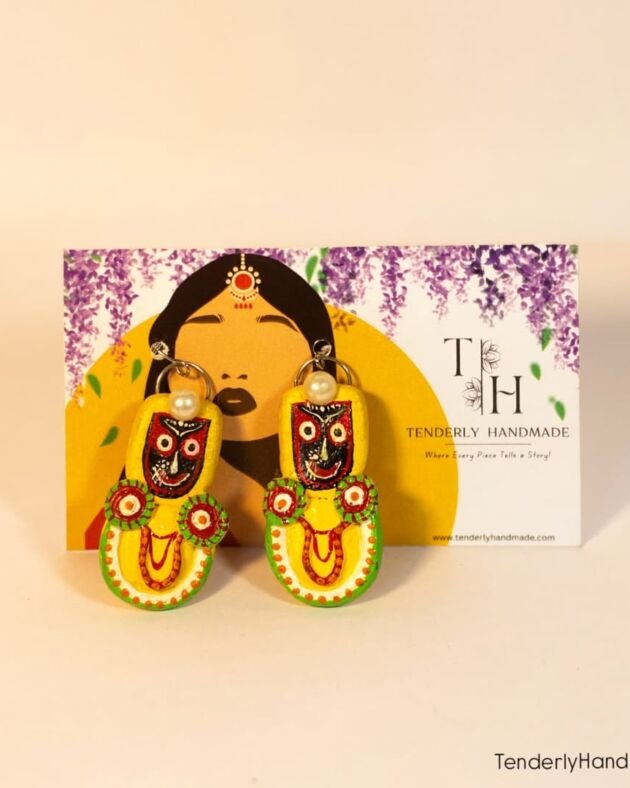 RathRaaga hand-painted earrings displayed on a Tenderly Handmade branding card, showcasing the cultural "Every Piece Tells a Story" aesthetic.