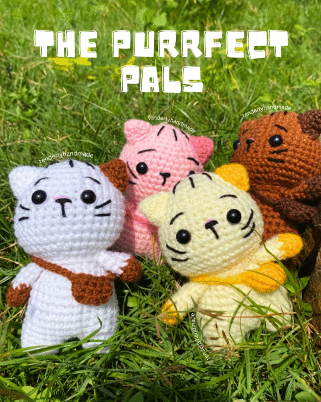 A group of four colorful mini crochet cats (white, pink, yellow, and brown) standing in green grass with the text "The Purrfect Pals.