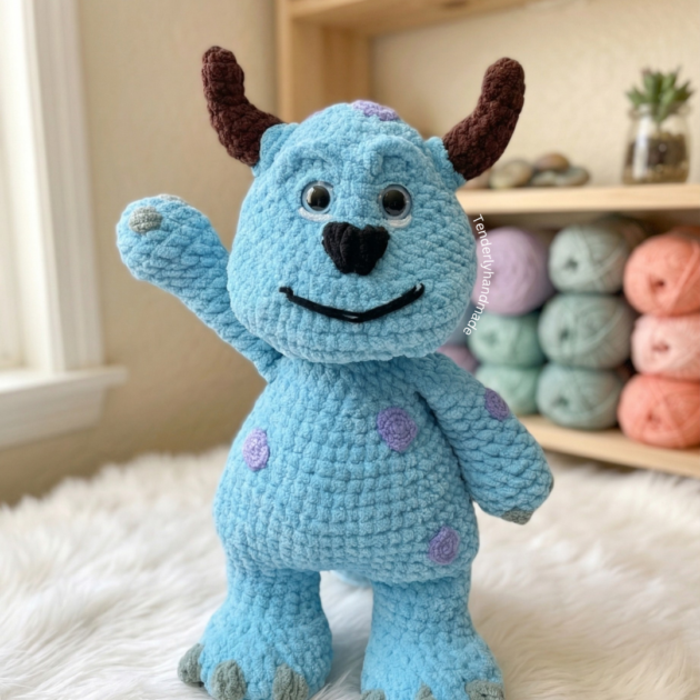 Sulley Crochet amigurumi plushie from Monsters Inc. holding a handmade flower bouquet by Tenderly Handmade.