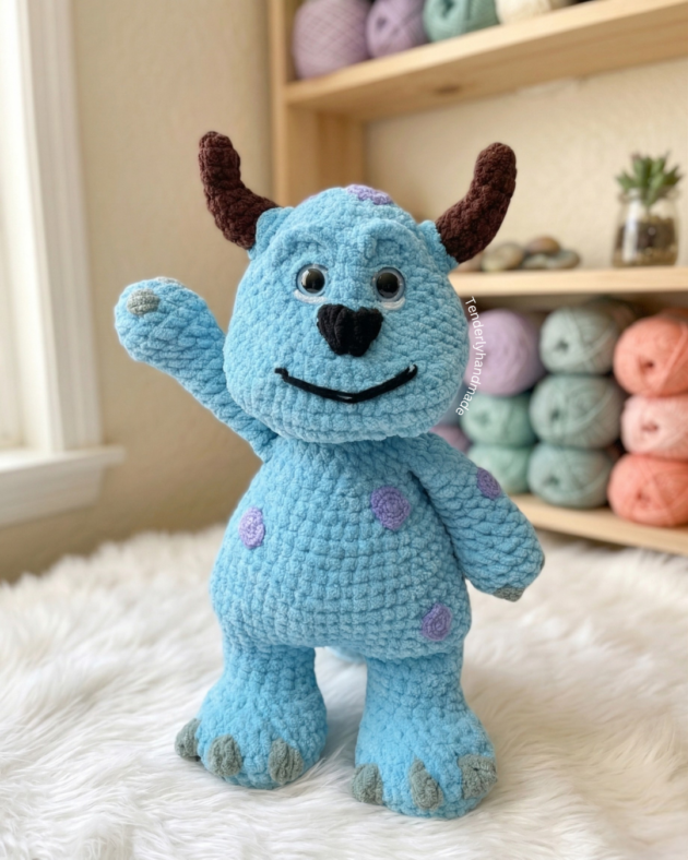 Sulley Crochet amigurumi plushie from Monsters Inc. holding a handmade flower bouquet by Tenderly Handmade.