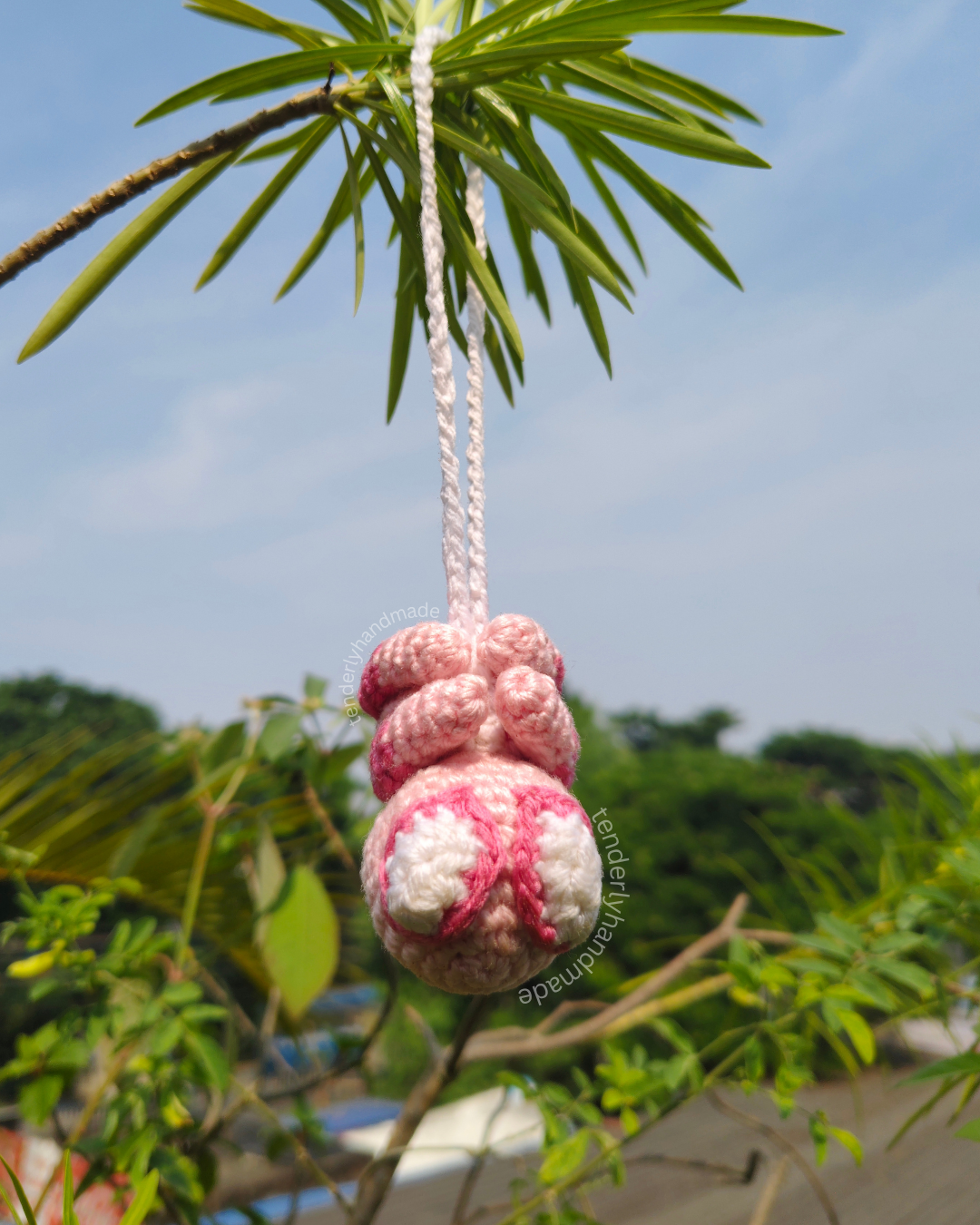 Soft pink Spider-Gwen crochet spiderman car hanging variant suspended outdoors